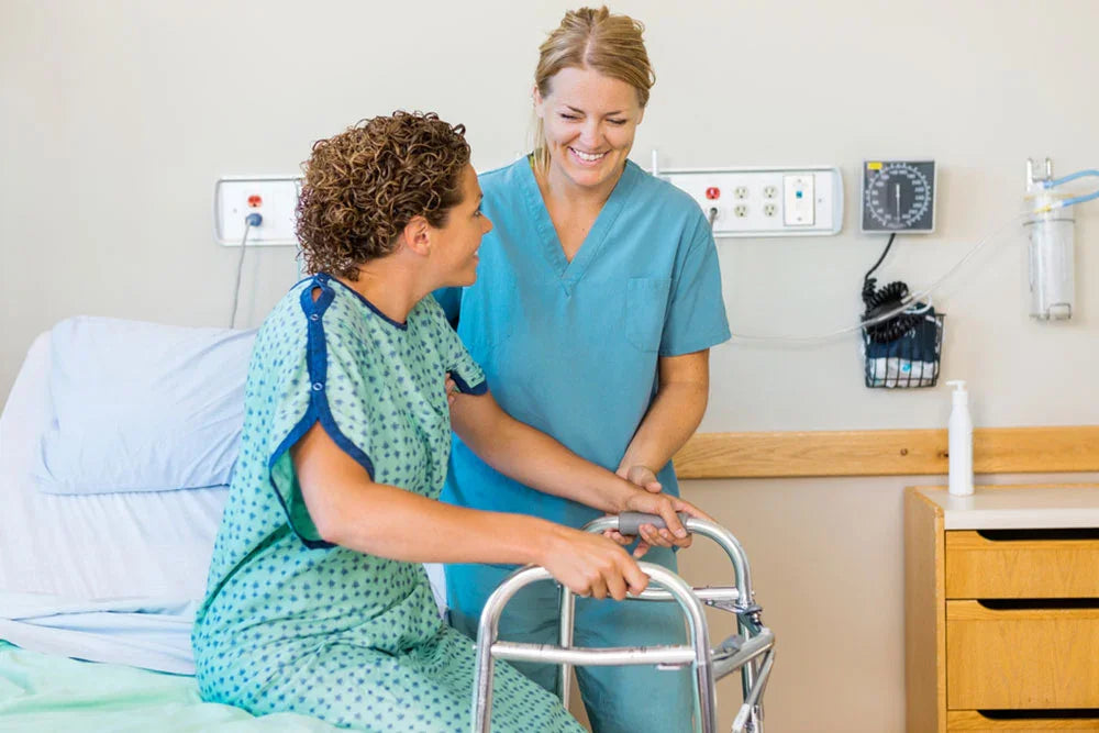 Nurse assisting patient with walker in hospital room, rehabilitation and home care supplies