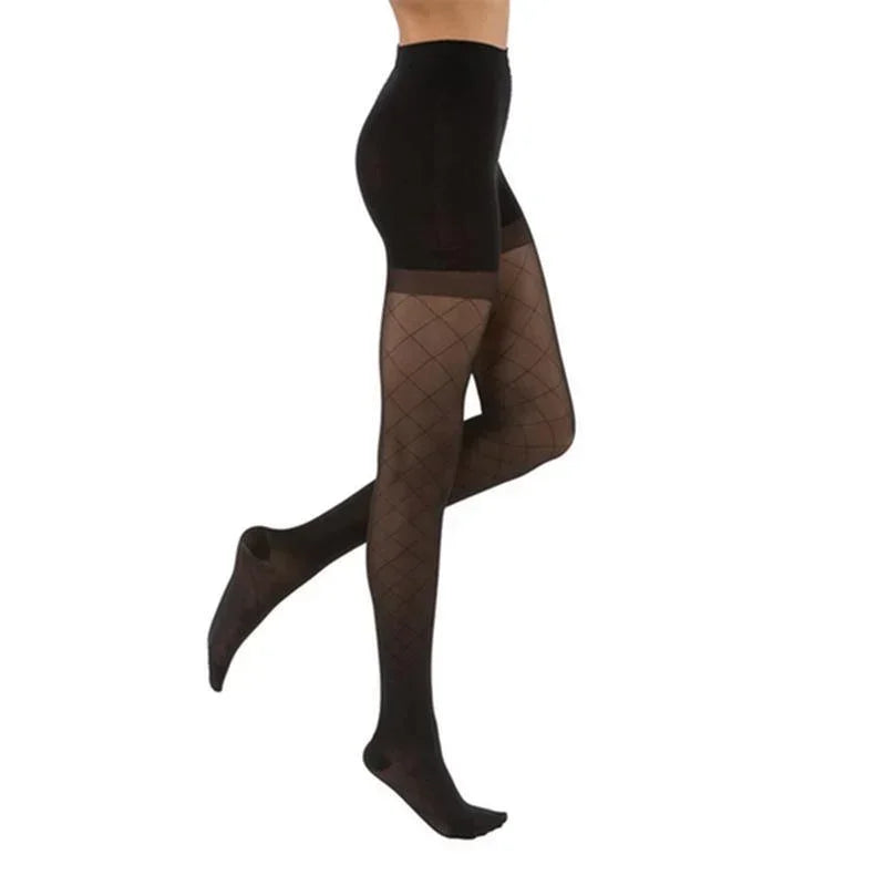 Black diamond pattern compression stockings, full length, sheer, worn on female legs