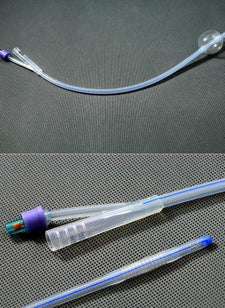 Sterile Foley catheter with balloon tip for urinary care on textured surface