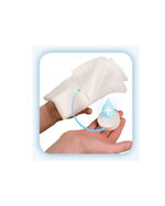 Hand holding medical gauze pads with an arrow and droplet icon, wound care supplies