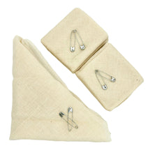 Gauze bandage rolls and triangular bandage with safety pins for first aid care