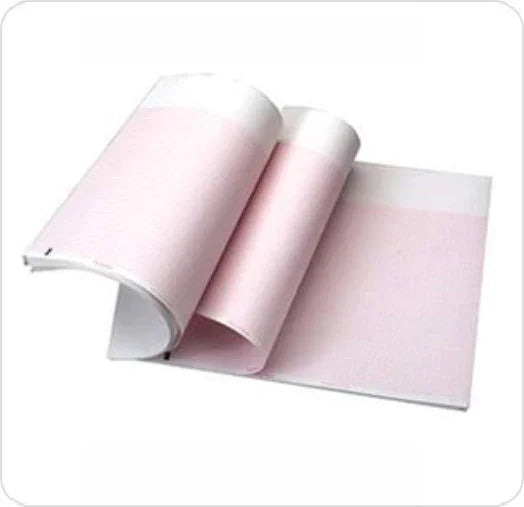 Open ECG paper booklet, pink grid sheets for medical recording, on white background