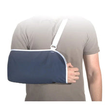 Adult wearing a navy blue medical arm sling for arm injury support