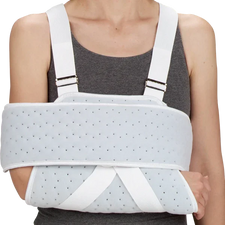 Person wearing a white medical arm sling shoulder immobilizer for injury support