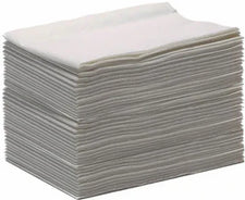 Stack of white disposable medical wipes or gauze pads for home care and first aid