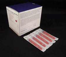Sterile filter needles in individual packaging next to product box on black background