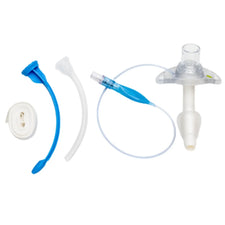 tracheostomy care kit with tube, suction catheter, dressing, obturator on white background
