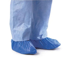 Disposable blue shoe covers worn with light blue protective pants for medical use