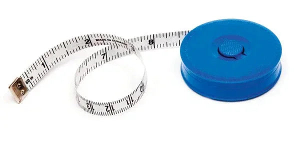 Blue retractable measuring tape with white, marked tape extended on white background