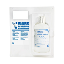 Wall-mounted emergency eye wash station with saline solution bottle and bilingual instructions