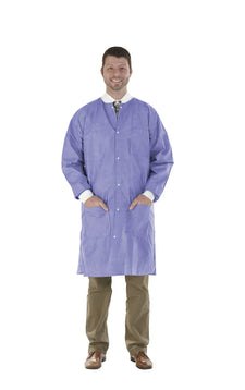 Man wearing a blue disposable lab coat, medical protective gown with pockets, isolated on white