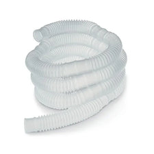 Corrugated clear medical respiratory tubing coiled on a white background