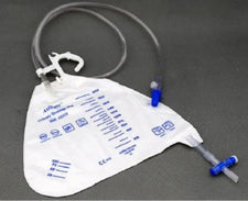 Urinary drainage bag with graduated measurement markings and connected tubing on a gray background