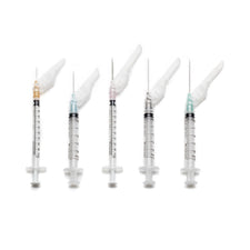 Five safety syringes with needles and protective caps, medical supplies on white background.