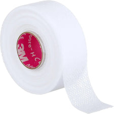 White medical adhesive tape roll with perforated texture for wound care and bandage securement