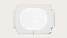 Sterile rectangular medical adhesive dressing with central absorbent pad on white background