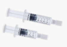Two 5mL clear medical syringes with measurement markings on a white background