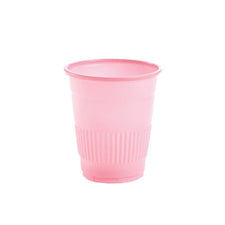 Pink disposable plastic cup with textured grip for medical or home care use