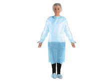 Woman wearing disposable blue medical isolation gown, hair cover, and shoe covers