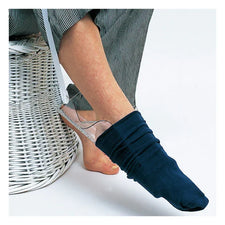 Person using a sock aid device to put on a navy sock, home care medical supply