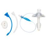 Tracheostomy care kit with tracheostomy tube, suction catheter, and neck tie on white background