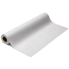 White disposable medical exam table paper roll on a plain background