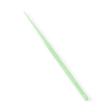 Green plastic medical comedone extractor tool with textured grip on white background