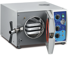 Medical sterilizer with control panel and stacked trays for healthcare supplies