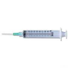 Sterile medical syringe with clear barrel and green needle, used for healthcare applications