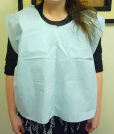 Person wearing disposable medical bib, protective clothing for healthcare or home care use