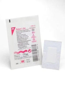 Sterile medical adhesive wound dressing pad in individual packaging on a white background.