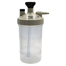 Oxygen humidifier bottle for respiratory therapy, clear plastic with beige lid.