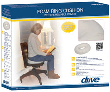 Foam ring cushion with removable cover for comfort and support, shown on a chair with a seated person.