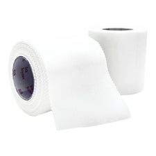 Two rolls of medical silk adhesive tape, one partially unrolled, on white background