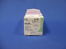 Nylon surgical sutures box 5-0 913B medical supplies on blue background