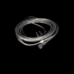 Clear oxygen nasal cannula tubing on black background, respiratory medical supply
