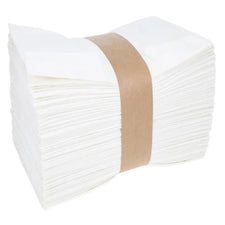 Stack of white disposable paper napkins bundled for medical and home care use