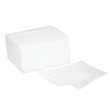 Stack of white non-woven gauze pads for medical or esthetic care on white background.