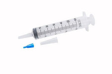 Sterile medical syringe with measurement markings and two detachable tips on white background