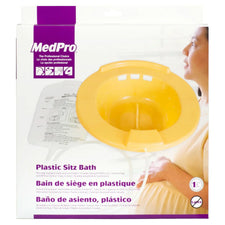 Plastic sitz bath kit in packaging, yellow basin with tubing, for home medical care.