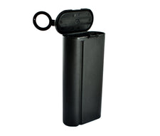 Black plastic sharps container with flip-top lid, used for safe needle disposal