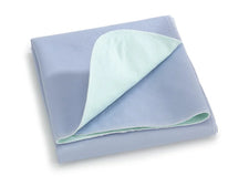 Light blue reusable waterproof underpad for home care or medical use, folded and layered