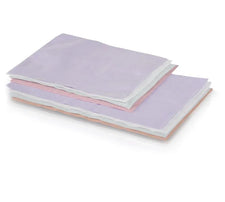 Stack of white disposable headrest covers tissue poly 10x13 for medical or spa use
